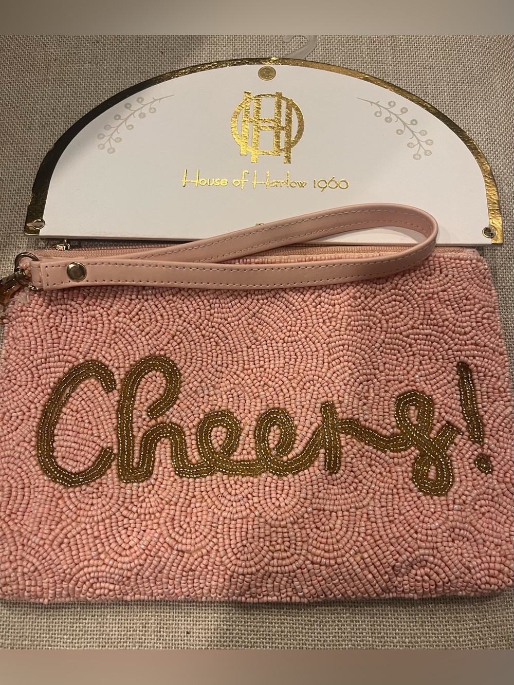 NWT House of Harlow 1960 Pink Beaded 'Cheers!' Wristlet Clutch with Gold Script